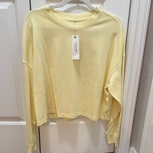 Calvin Klein Light Yellow Cropped Crewneck Tee- Women’s size medium
